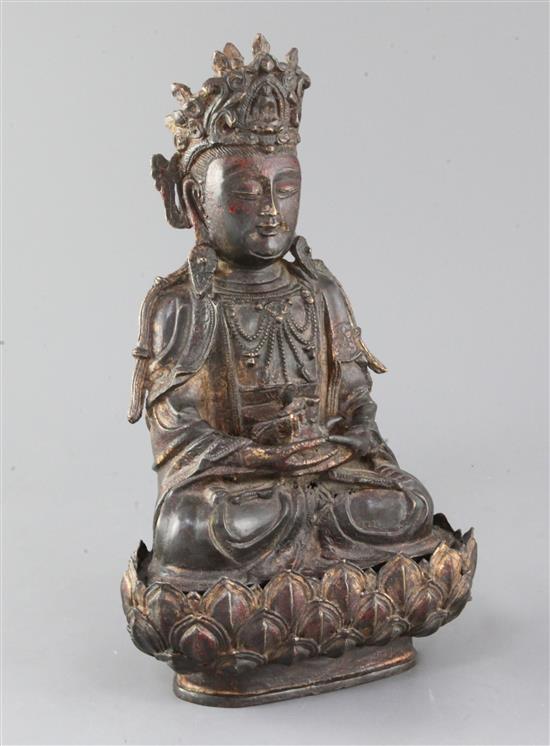 A Chinese lacquered bronze seated figure of Guanyin, possibly Ming dynasty, H. 31cm